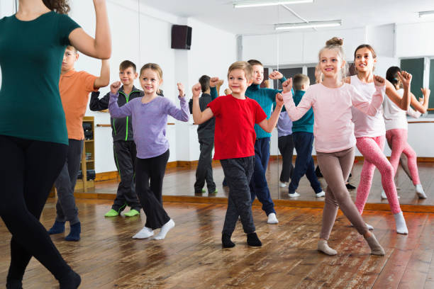 Friendly  children dancing contemp in studio smiling and having fun